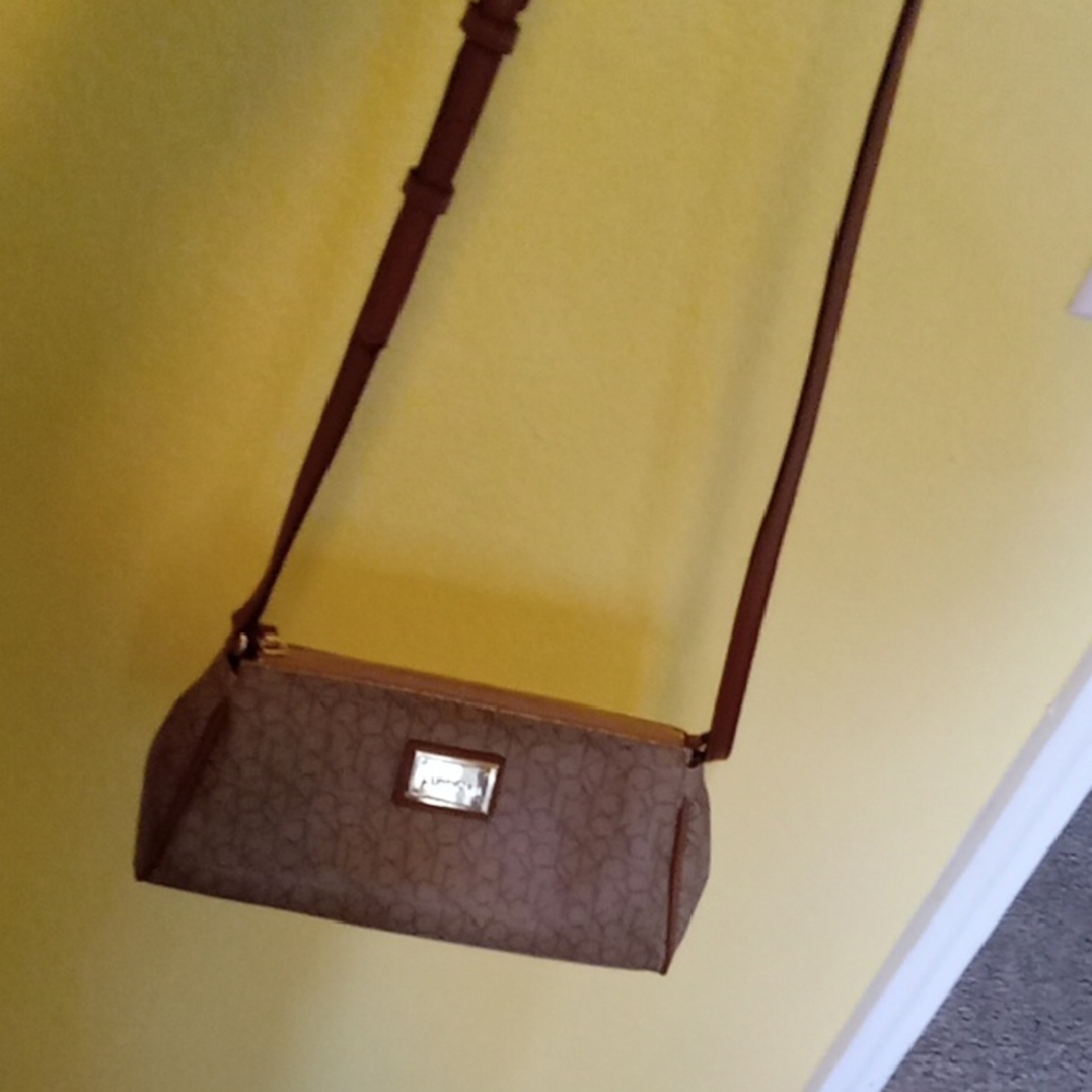 Calvin Klein Brown Leather Crossbody Bag with Cylindrical Design